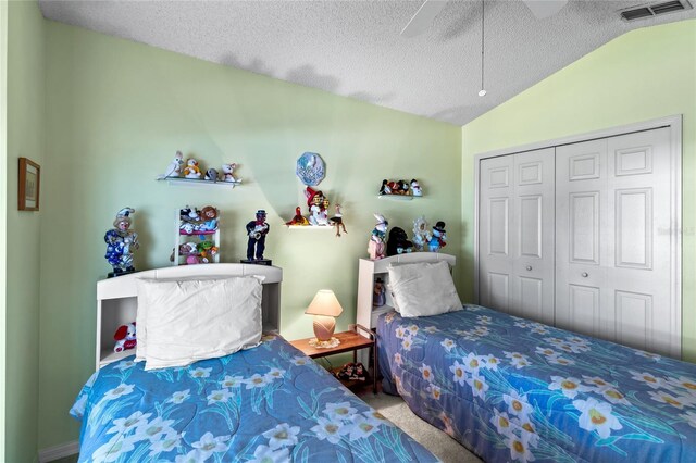 3603 Westerham Dr, Clermont, FL 34711 - bedroom featuring visible vents, a closet, a textured ceiling, carpet floors, and lofted ceiling