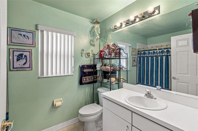 3603 Westerham Dr, Clermont, FL 34711 - bathroom with toilet, a shower with curtain, vanity, and baseboards