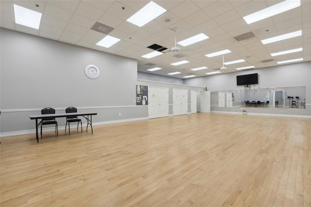3603 Westerham Dr, Clermont, FL 34711 - workout area featuring a paneled ceiling, baseboards, visible vents, and wood finished floors