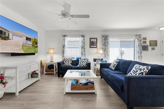 living room featuring wood finished floors and ceiling fan