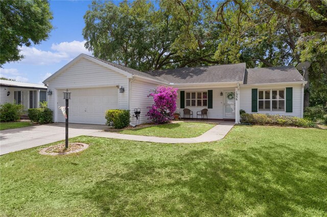 1358 E Schwartz Blvd, The Villages, FL 32159 - single story home with an attached garage, driveway, a shingled roof, and a front lawn