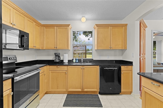 1358 E Schwartz Blvd, The Villages, FL 32159 - kitchen with a sink, arched walkways, black appliances, and a healthy amount of sunlight