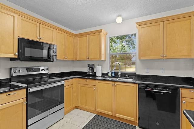 1358 E Schwartz Blvd, The Villages, FL 32159 - kitchen with light tile patterned flooring, dark countertops, a textured ceiling, a sink, and black appliances
