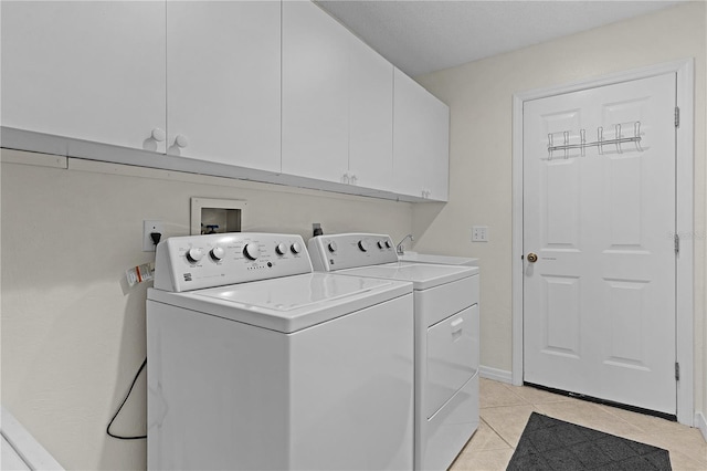 1358 E Schwartz Blvd, The Villages, FL 32159 - laundry area with a sink, cabinet space, light tile patterned flooring, and washing machine and clothes dryer