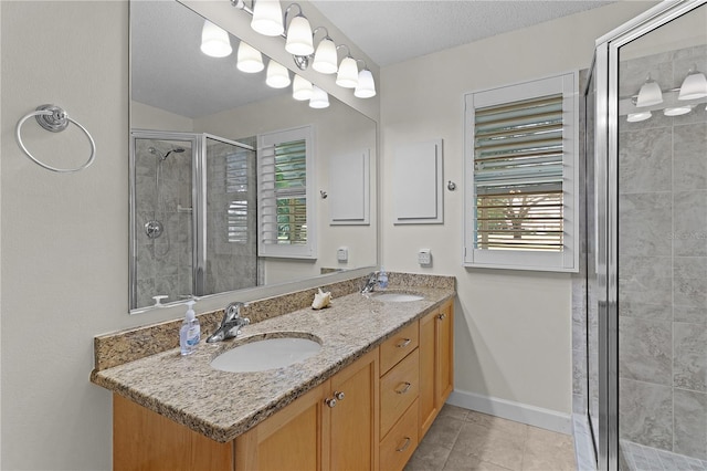 1358 E Schwartz Blvd, The Villages, FL 32159 - bathroom featuring double vanity, a sink, tile patterned floors, and a shower stall