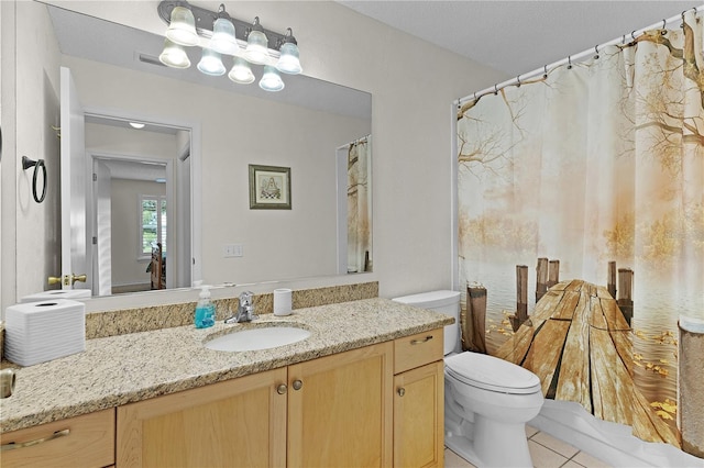 1358 E Schwartz Blvd, The Villages, FL 32159 - bathroom featuring tile patterned flooring, toilet, and vanity