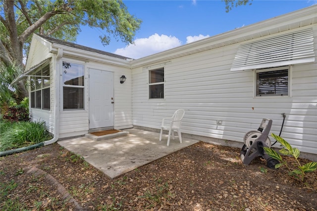 1358 E Schwartz Blvd, The Villages, FL 32159 - back of property featuring a sunroom and a patio area