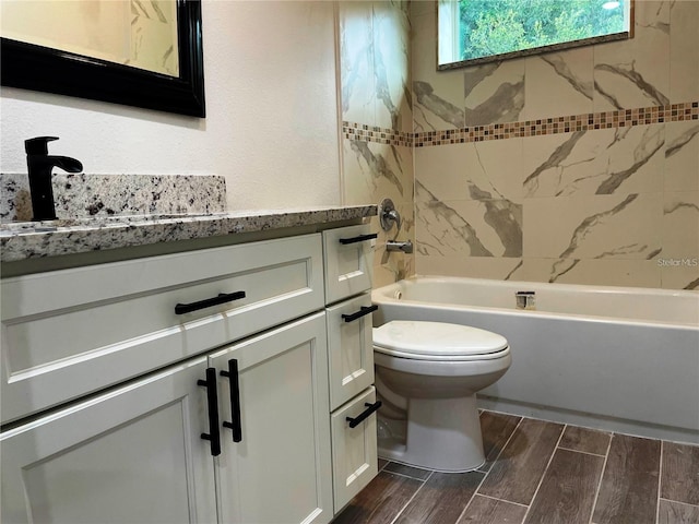 full bath featuring toilet, shower / bathing tub combination, vanity, and wood tiled floor
