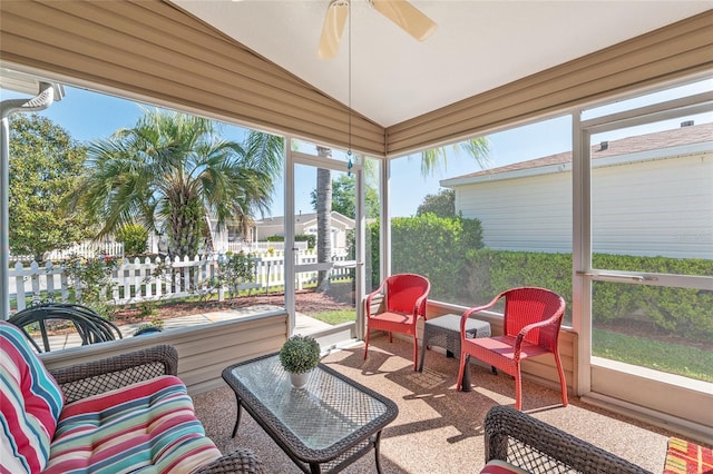 sunroom with a ceiling fan