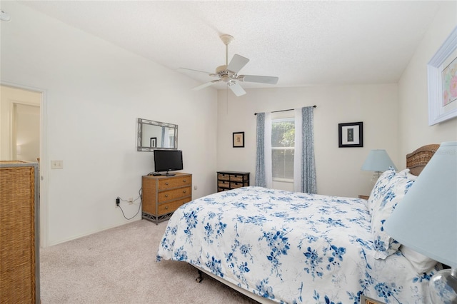bedroom with ceiling fan and carpet flooring