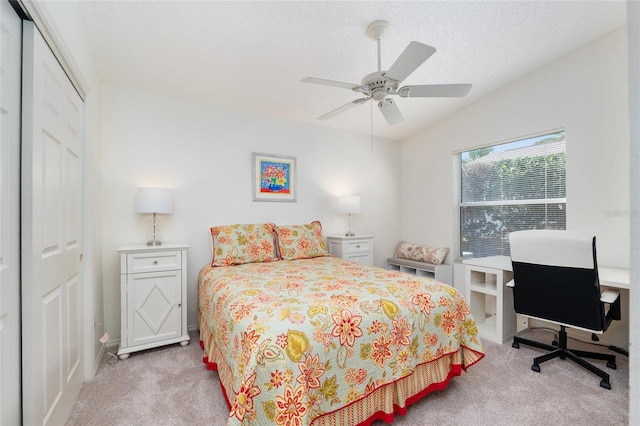 carpeted bedroom featuring a closet, ceiling fan, and vaulted ceiling