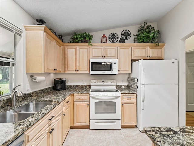 511 Chula Vista Ave, The Villages, FL 32159 - kitchen featuring light brown cabinetry, a sink, white appliances, and a textured ceiling
