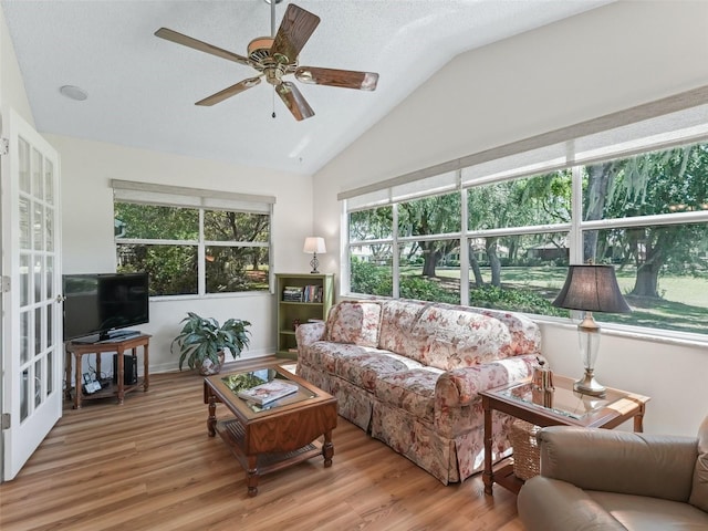 511 Chula Vista Ave, The Villages, FL 32159 - living area featuring vaulted ceiling, a ceiling fan, wood finished floors, and french doors