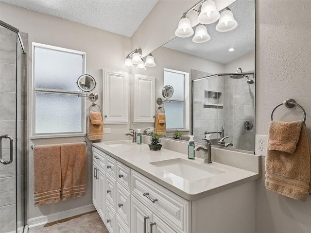 511 Chula Vista Ave, The Villages, FL 32159 - bathroom with a shower stall, a sink, and a textured ceiling