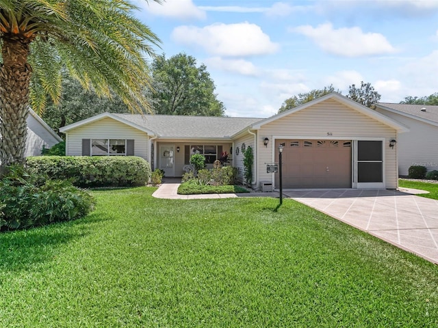 511 Chula Vista Ave, The Villages, FL 32159 - ranch-style home featuring a garage, driveway, and a front lawn