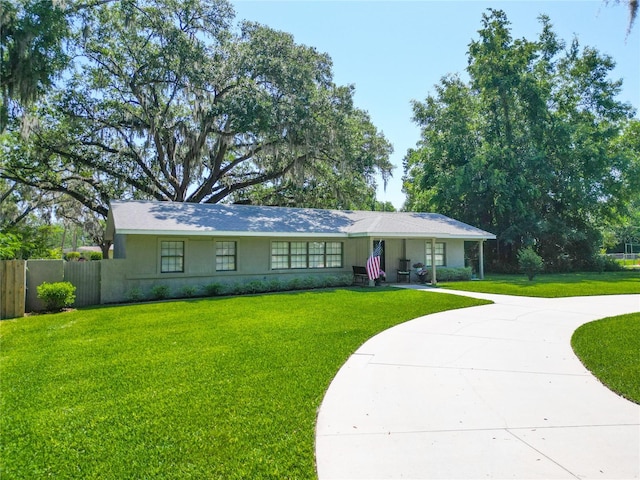 203 SE 30th Ave, Ocala, FL 34471 - ranch-style house with curved driveway and stucco siding
