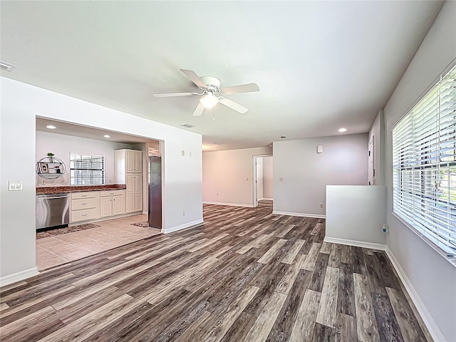 203 SE 30th Ave, Ocala, FL 34471 - unfurnished living room featuring wood finished floors, a ceiling fan, baseboards, and recessed lighting