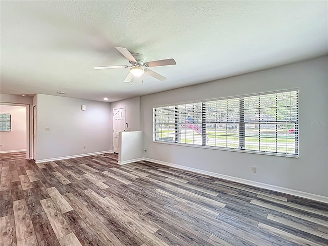 203 SE 30th Ave, Ocala, FL 34471 - unfurnished room featuring wood finished floors, baseboards, a ceiling fan, and a textured ceiling