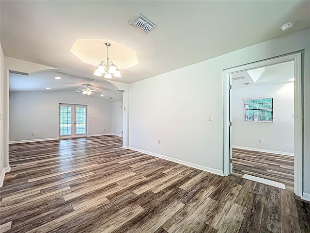 203 SE 30th Ave, Ocala, FL 34471 - spare room with wood finished floors, ceiling fan, a chandelier, a smoke detector, and vaulted ceiling