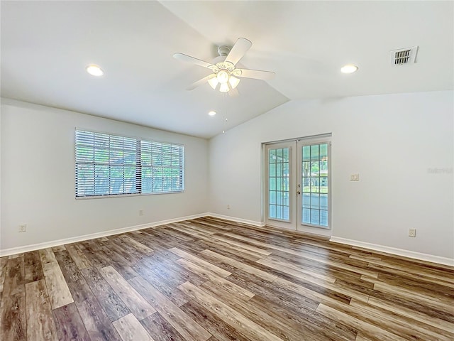 203 SE 30th Ave, Ocala, FL 34471 - empty room with ceiling fan, wood finished floors, vaulted ceiling, baseboards, and recessed lighting
