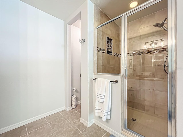 203 SE 30th Ave, Ocala, FL 34471 - bathroom with tile patterned flooring, a shower stall, and baseboards