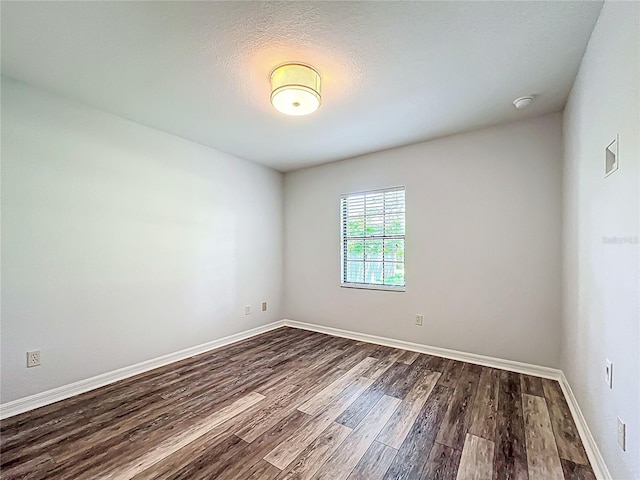 203 SE 30th Ave, Ocala, FL 34471 - spare room with dark wood-style floors and baseboards