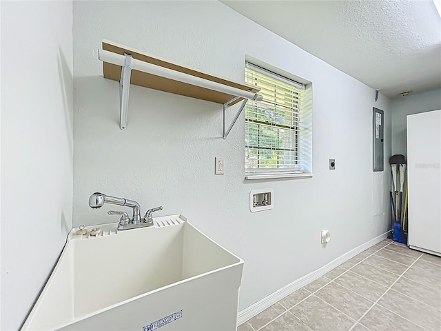 203 SE 30th Ave, Ocala, FL 34471 - laundry area featuring washer hookup, hookup for an electric dryer, baseboards, light tile patterned floors, and a textured ceiling