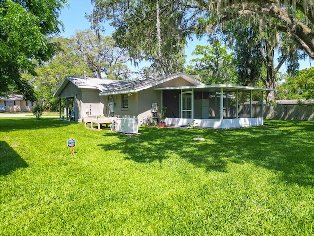 203 SE 30th Ave, Ocala, FL 34471 - rear view of property featuring a sunroom