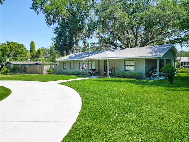 203 SE 30th Ave, Ocala, FL 34471 - ranch-style home featuring a front yard, stucco siding, and curved driveway