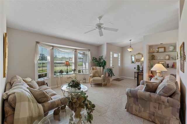 6608 Borg, Leesburg, FL 34748 - living area featuring carpet flooring, baseboards, a ceiling fan, and vaulted ceiling