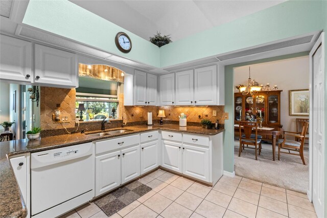 6608 Borg, Leesburg, FL 34748 - kitchen with a chandelier, light tile patterned flooring, white dishwasher, light colored carpet, and a sink