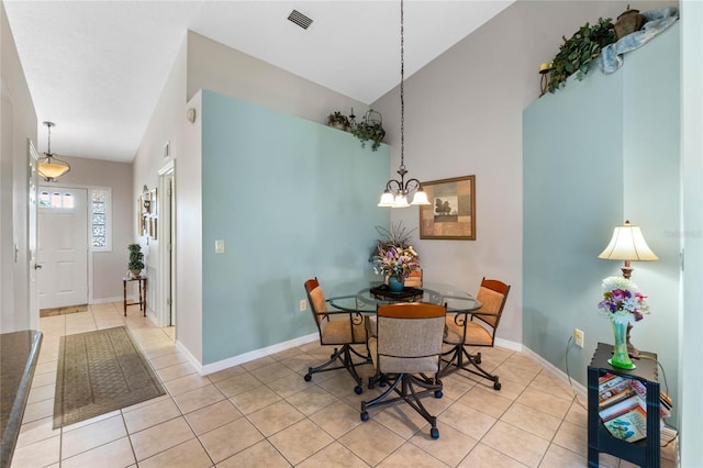 6608 Borg, Leesburg, FL 34748 - tiled dining space featuring baseboards, high vaulted ceiling, a notable chandelier, and visible vents