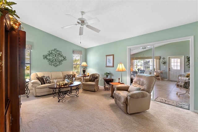 6608 Borg, Leesburg, FL 34748 - carpeted living area with baseboards, a ceiling fan, vaulted ceiling, and plenty of natural light