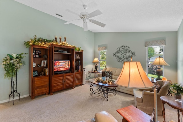 6608 Borg, Leesburg, FL 34748 - carpeted living room featuring ceiling fan, vaulted ceiling, visible vents, and a wealth of natural light