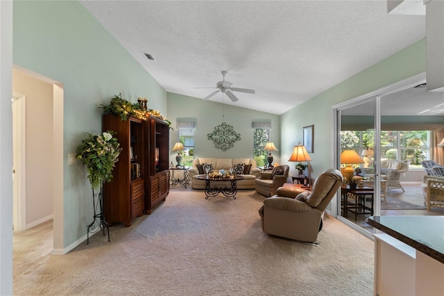 6608 Borg, Leesburg, FL 34748 - carpeted living room with lofted ceiling, baseboards, a textured ceiling, visible vents, and ceiling fan