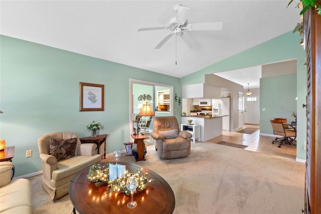 6608 Borg, Leesburg, FL 34748 - living room featuring light carpet, baseboards, a ceiling fan, and lofted ceiling