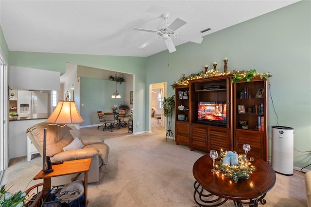 6608 Borg, Leesburg, FL 34748 - living area with ceiling fan, light colored carpet, visible vents, lofted ceiling, and baseboards