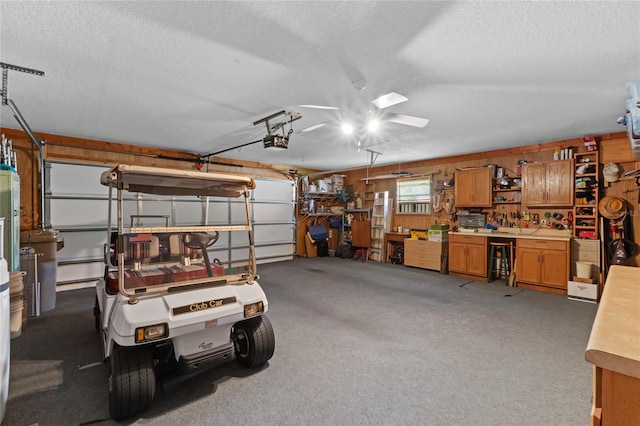 6608 Borg, Leesburg, FL 34748 - garage with ceiling fan, a garage door opener, and a workshop area