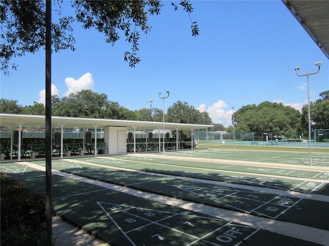 6608 Borg, Leesburg, FL 34748 - view of property's community with fence and shuffleboard