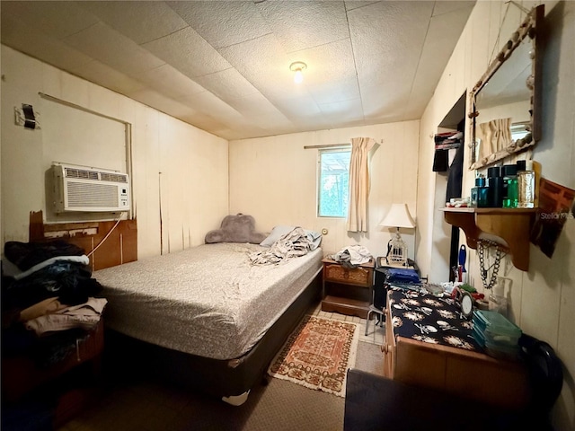 bedroom with a wall mounted air conditioner