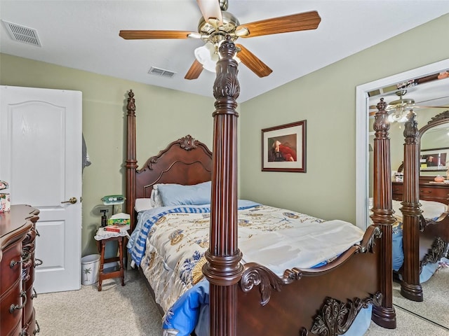 bedroom with carpet floors, visible vents, and ceiling fan