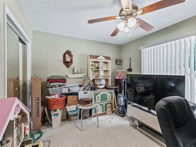 interior space with ceiling fan