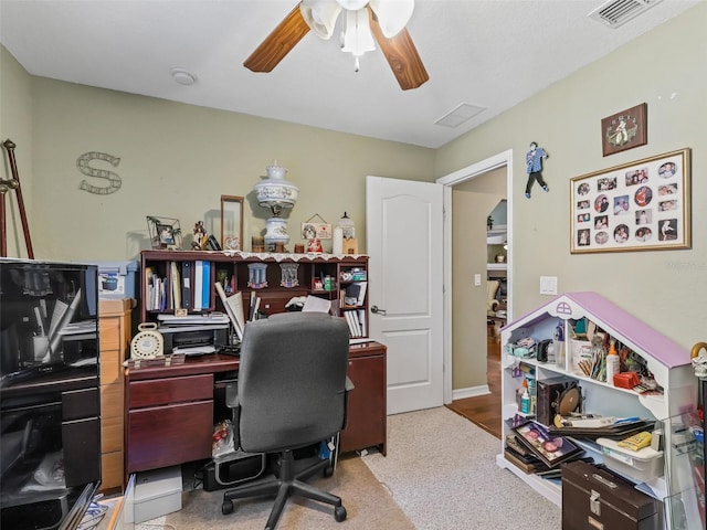 office area with visible vents and ceiling fan