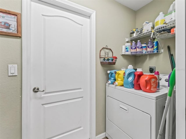 laundry area featuring laundry area and washer / clothes dryer