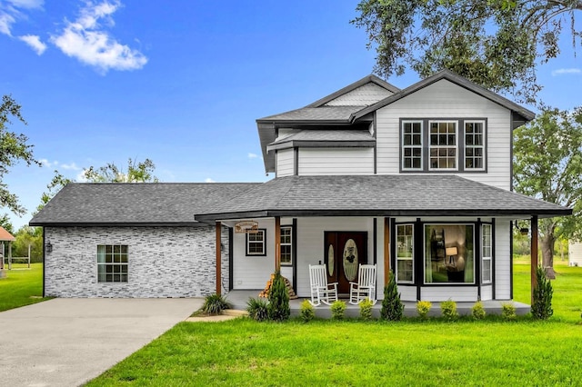 10901 Island Grove Rd, Clermont, FL 34711 - view of front of property featuring covered porch, a shingled roof, and a front yard