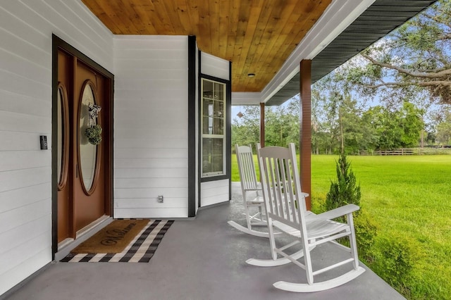 10901 Island Grove Rd, Clermont, FL 34711 - view of exterior entry with a yard