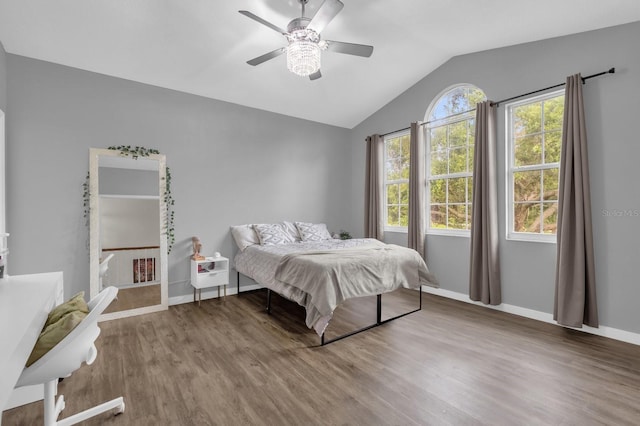 10901 Island Grove Rd, Clermont, FL 34711 - bedroom featuring lofted ceiling, wood finished floors, and a ceiling fan