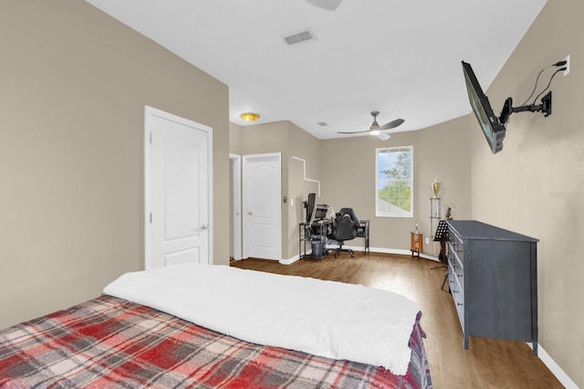 10901 Island Grove Rd, Clermont, FL 34711 - bedroom featuring light wood finished floors, an office area, and ceiling fan