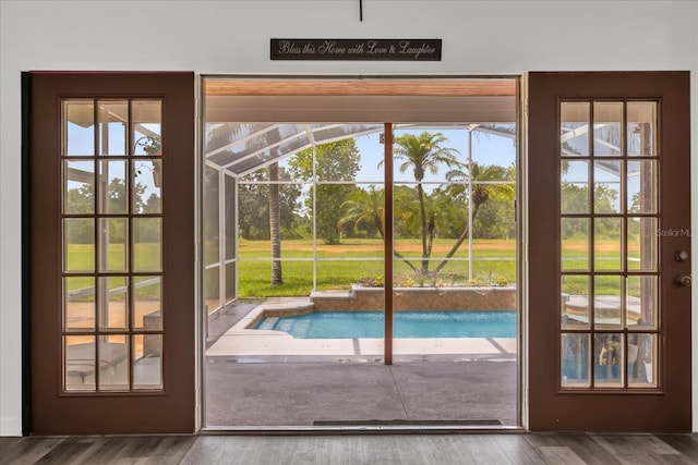 10901 Island Grove Rd, Clermont, FL 34711 - doorway to outside featuring wood finished floors