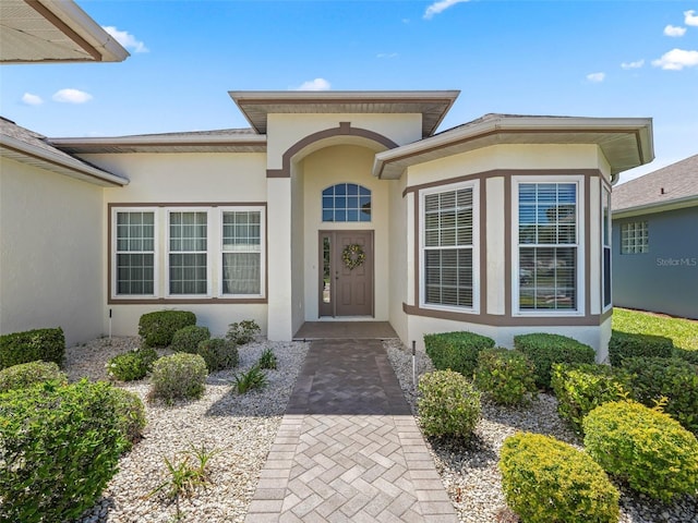 17787 SE 114th Ave, Summerfield, FL 34491 - doorway to property featuring stucco siding